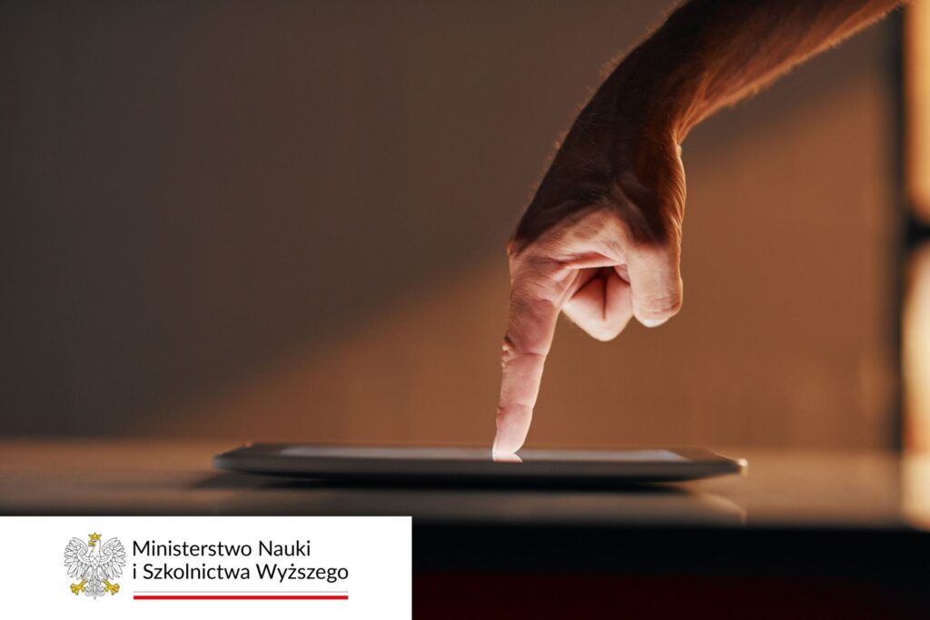 palec wskazujący na tablet